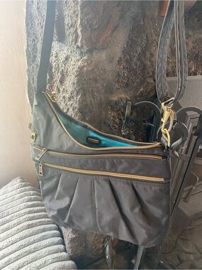 Travelon Black Crossbody Bag with Gold Hardware and Teal Lining